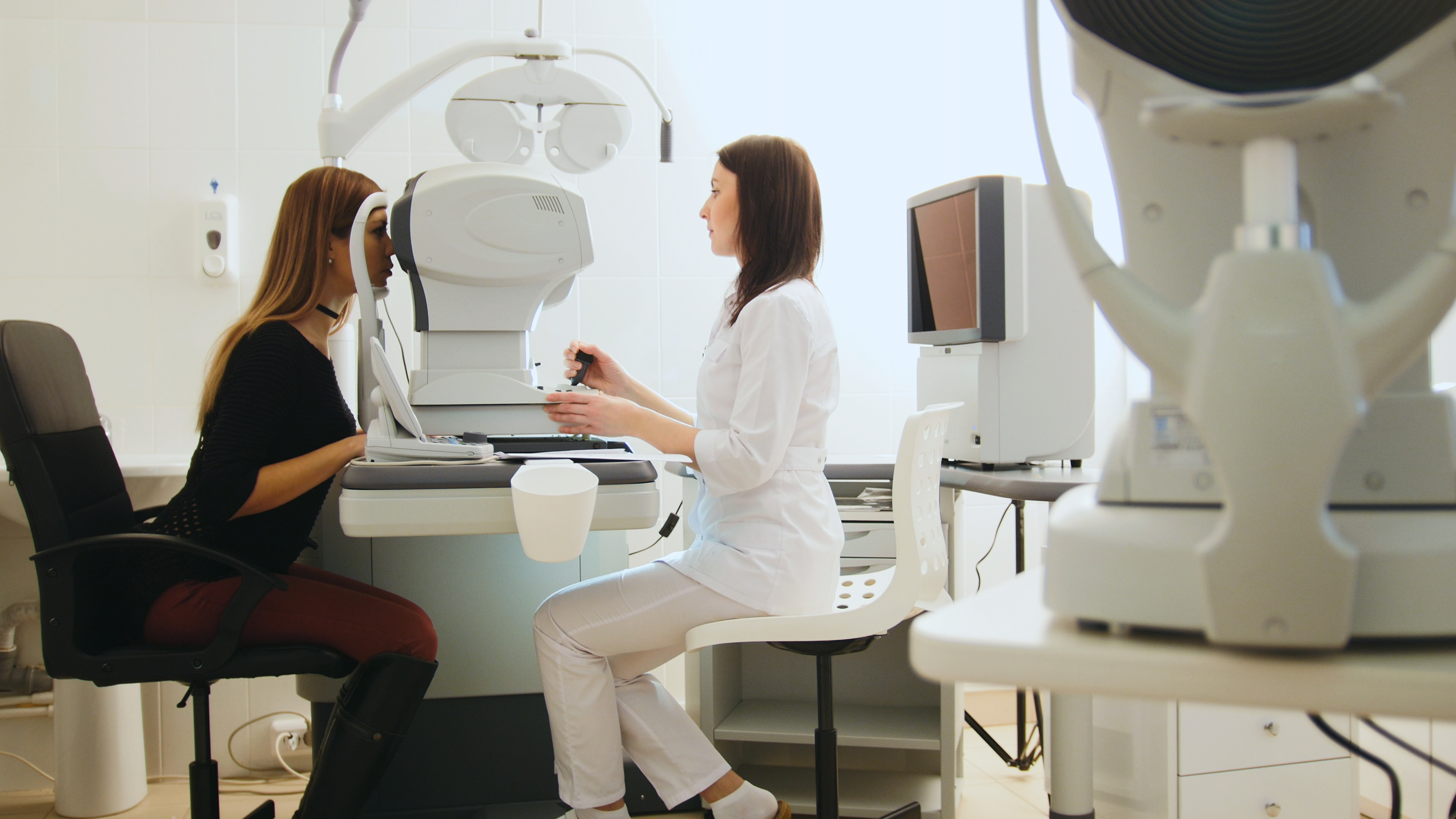 Optometrist performing an eye exam